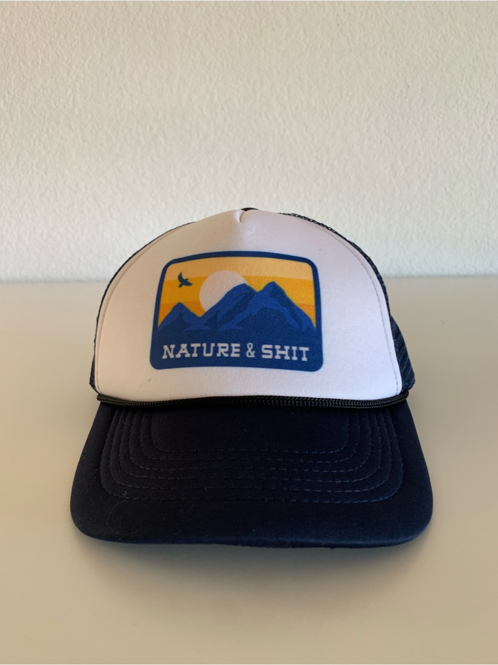Nature & Shit Trucker Hat - White Front with Navy Brim